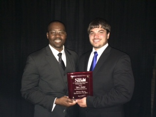 Decker (R) receives SBA award