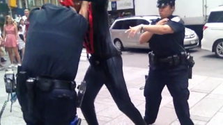 u.s., spider-man, new york city, times square, punches cop