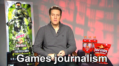 Geoff Keighley next to Halo poster and Doritos bags