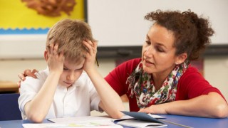 Child with ADHD and teacher