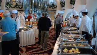 A hotel offers a Christmas buffet and people help themselves