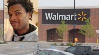 John Crawford III is pictured next to a Wal-Mart