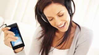 Photostock photo of woman listening to music