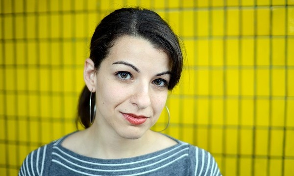 Anita Sarkeesian yellow background