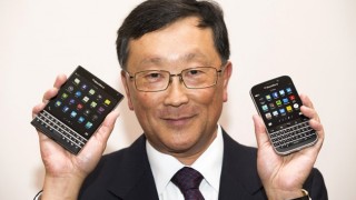 Undated photo of BB CEO holding two new phones
