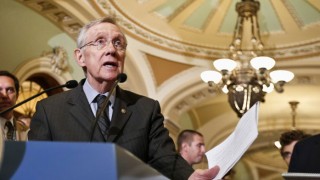 Harry Reid speaking at a meeting