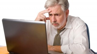 Sedentary man sitting with laptop