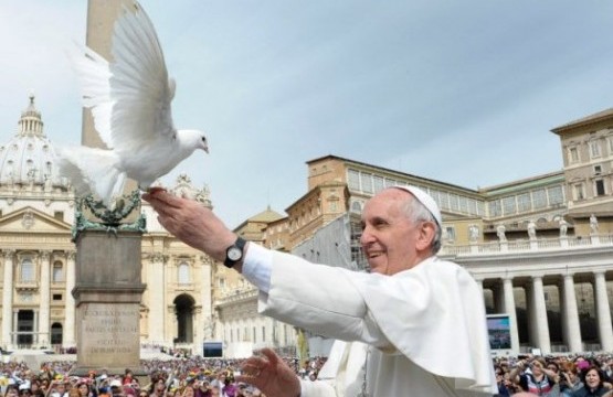 Undate photo of Pope Francis welcoming a peace dove