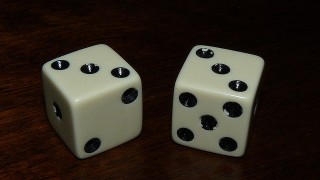 A pair of dice with threes on them