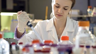 A scientists works in a lab