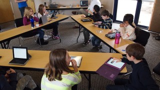Children use iPads in the classroom