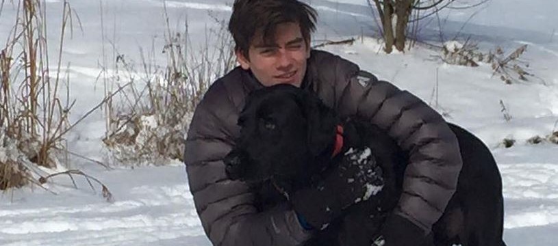 Cayman Naib and his dog in the snow