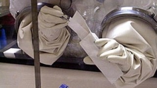 Pictured is an agent working in a bio lab