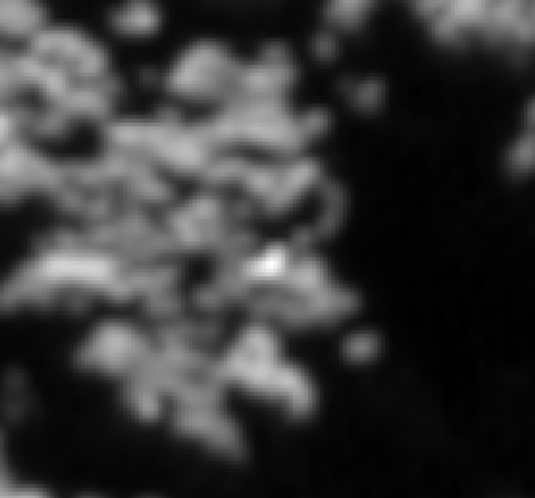 Bright spot on 67P/Churyumov-Gerasimenko provides possible location of Philae lander.