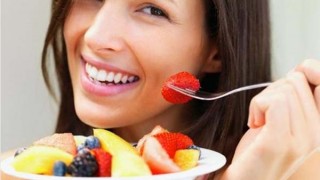 stock photo of women eating fruit